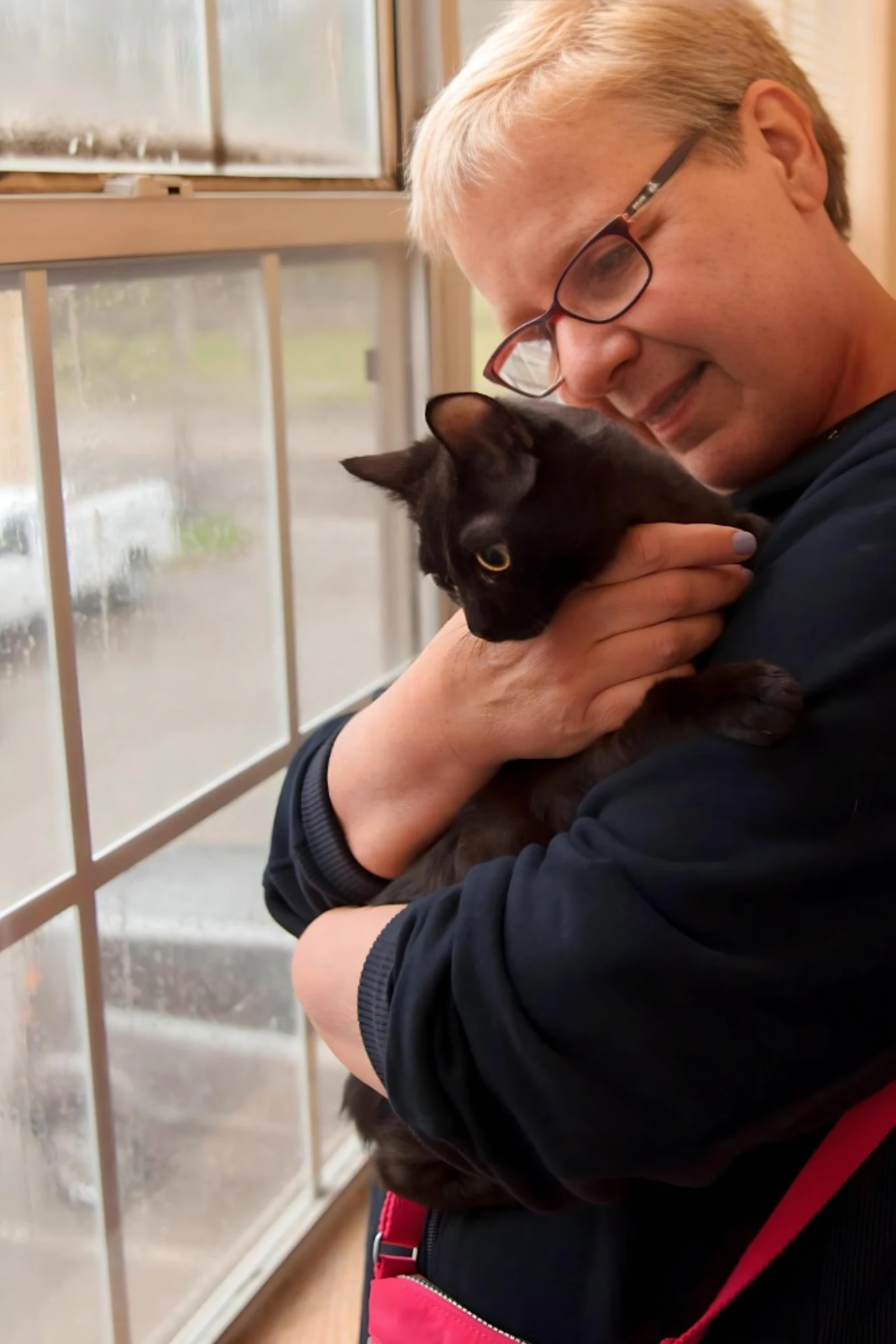Susan with a rescue cat in foster care