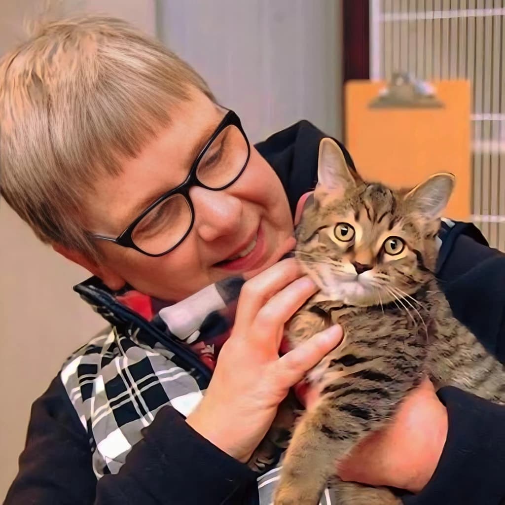 Susan, a founding member of Ohio Hound Rescue, holding a foster kitten